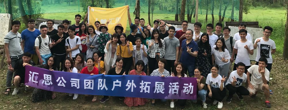 Cyberwisdom colleagues smiling together outdoors at a team activity